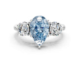 White gold Three-Stone Fancy Blue Pear Cut Diamond Channel Set Engagement Ring with Prong Setting