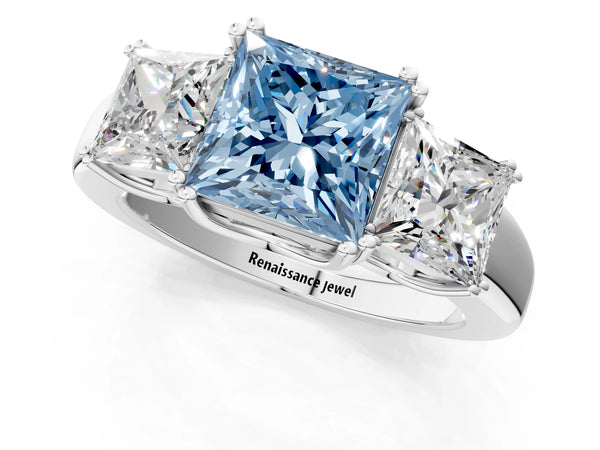 White gold Three-Stone Fancy Blue Princess Cut Cut Diamond Ring with Channel Set Band and Four-Prong Setting