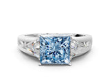 White gold Three-Stone Fancy Blue Princess Cut Cut Diamond Ring with Trillion Side Stones on a Split Shank Band