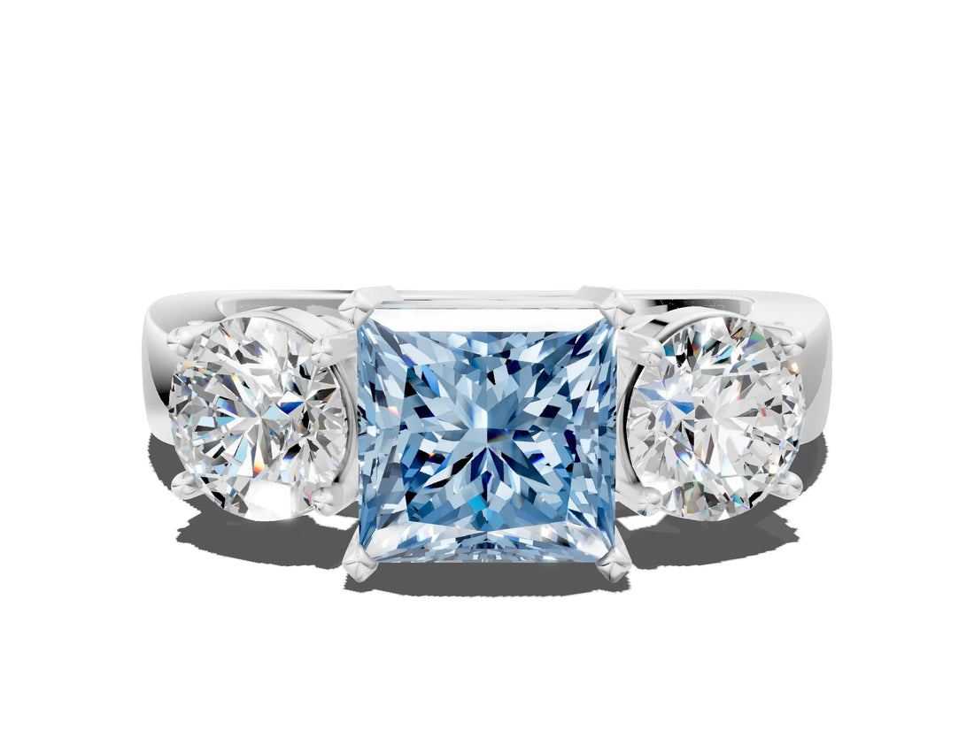 White gold Three-Stone Fancy Blue Princess Cut Diamond Ring with Round Side Stones, Classic Band, and Four-Prong Setting