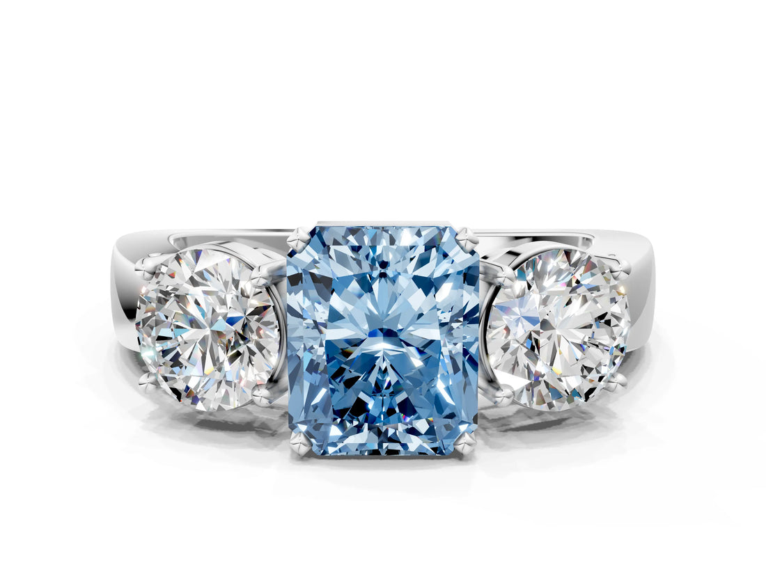 White gold Three-Stone Fancy Blue Radiant Cut Diamond Ring with Round Side Stones, Classic Band, and Four-Prong Setting