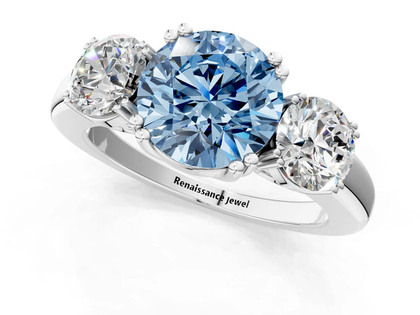 White gold Three-Stone Fancy Blue Round Cut Cut Diamond Ring with Channel Set Band and Four-Prong Setting