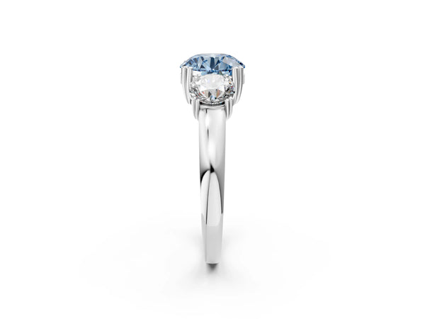 White gold Three-Stone Fancy Blue Round Cut Cut Diamond Ring with Channel Set Band and Four-Prong Setting
