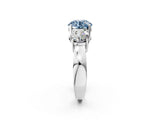 White gold Three-Stone Fancy Blue Round Cut Diamond Ring with Round Side Stones, Classic Band, and Four-Prong Setting_2