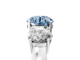 White gold Three-Stone Fancy Blue Round Cut Diamond Ring with Round Side Stones, Classic Band, and Four-Prong Setting_5