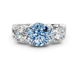 White gold Three-Stone Fancy Blue Round Cut Diamond Ring with Round Side Stones, Classic Band, and Four-Prong Setting