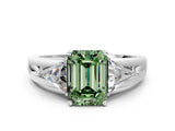 White gold Three-Stone Fancy Green Emerald Cut Cut Diamond Ring with Trillion Side Stones on a Split Shank Band