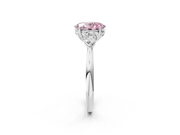 Platinum Three-Stone Fancy Pink Oval Cut Brilliant Diamond Solitaire Ring with Tapered Band and Four-Prong Setting