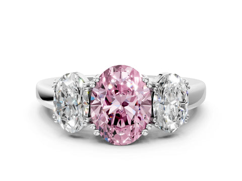 White gold Three-Stone Fancy Pink Oval Cut Cut Diamond Ring with Channel Set Band and Four-Prong Setting