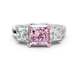 White gold Three-Stone Fancy Pink Princess Cut Cut Diamond Ring with Channel Set Band and Four-Prong Setting