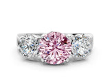 White gold Three-Stone Fancy Pink Round Cut Diamond Ring with Round Side Stones, Classic Band, and Four-Prong Setting