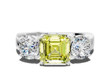 White gold Three-Stone Fancy Yellow Asscher Cut Diamond Ring with Round Side Stones, Classic Band, and Four-Prong Setting