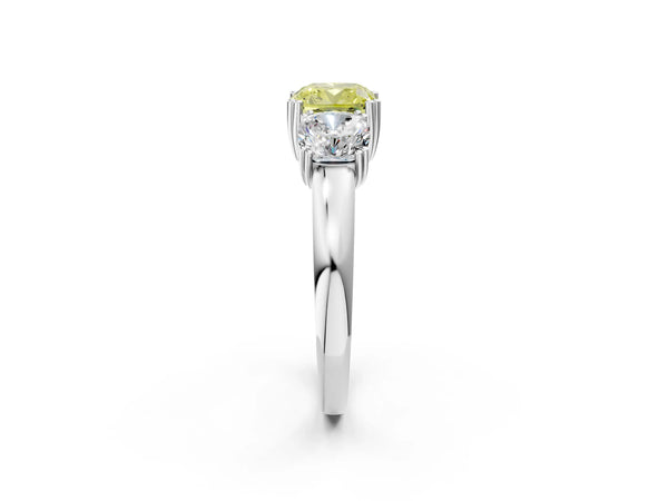 Platinum Three-Stone Fancy Yellow Cushion Cut Cut Diamond Ring with Channel Set Band and Four-Prong Setting