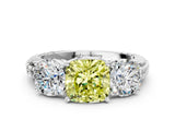 White gold Three-Stone Fancy Yellow Cushion Cut Cut Diamond Ring with Channel-Set Band and Prong Setting