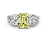 White gold Three-Stone Fancy Yellow Emerald Cut Cut Diamond Ring with Channel-Set Band and Prong Setting