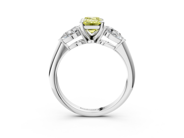 White gold Three-Stone Fancy Yellow Emerald Cut Diamond Ring with Pear Side Stones and Four-Prong Setting