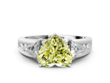 White gold Three-Stone Fancy Yellow Heart Cut Cut Diamond Ring with Trillion Side Stones on a Split Shank Band