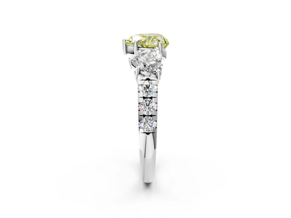 Platinum Three-Stone Fancy Yellow Heart Cut Diamond Pavé Band with Prong Setting