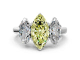 White gold Three-Stone Fancy Yellow Marquise Cut Cut Diamond Ring with Channel Set Band and Four-Prong Setting