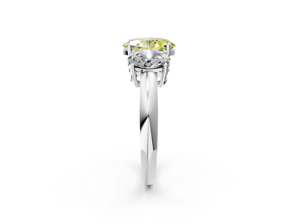 White gold Three-Stone Fancy Yellow Oval Cut Cut Diamond Engagement Ring with Prong Setting on a White Gold Band