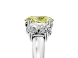 White gold Three-Stone Fancy Yellow Oval Cut Cut Diamond Ring with Channel Set Band and Four-Prong Setting_41
