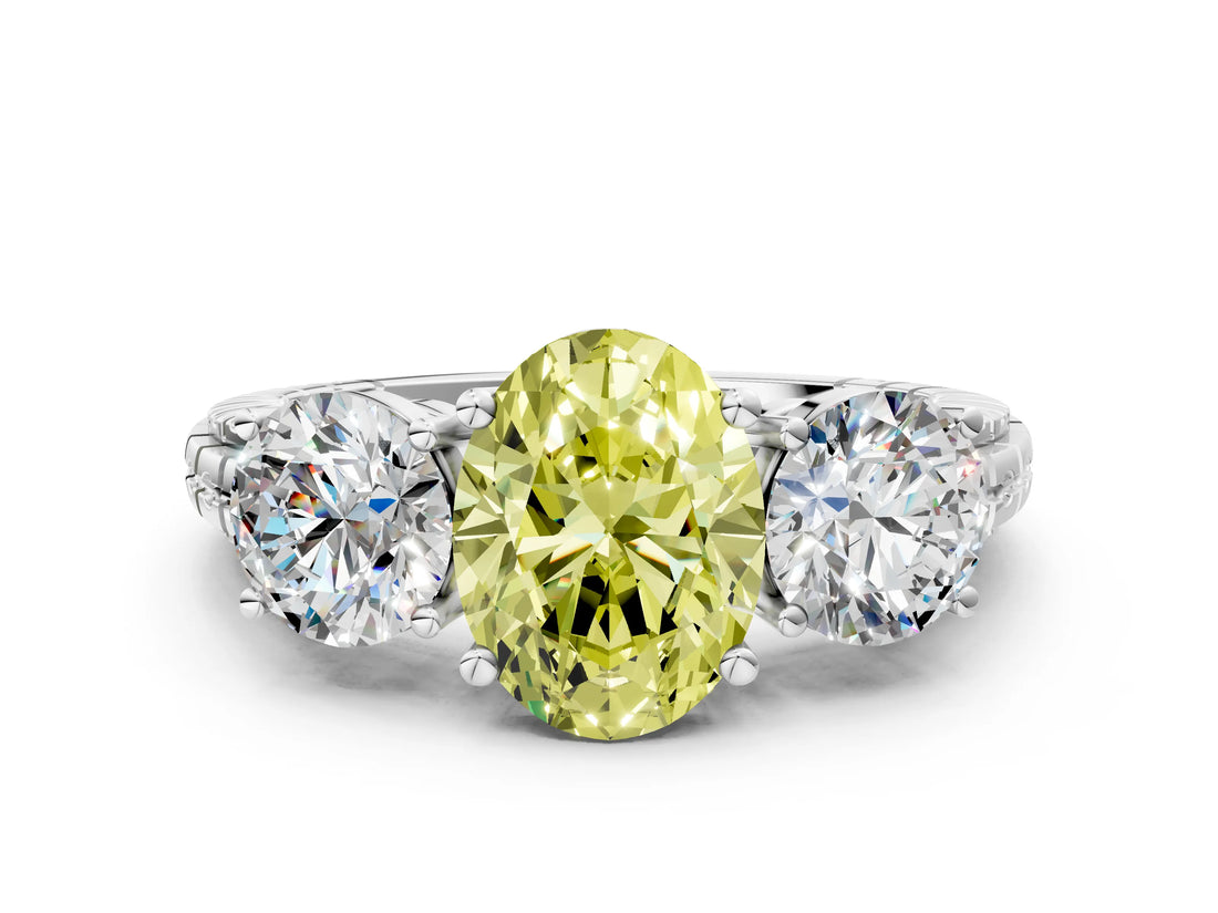 White gold Three-Stone Fancy Yellow Oval Cut Cut Diamond Ring with Channel-Set Band and Prong Setting