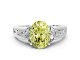 White gold Three-Stone Fancy Yellow Oval Cut Cut Diamond Ring with Trillion Side Stones on a Split Shank Band