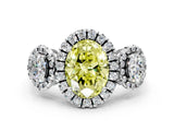 White gold Three-Stone Fancy Yellow Oval Cut Halo Diamond Ring with Pave Band and Four-Prong Setting