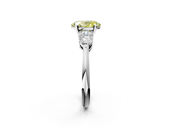 Platinum Three-Stone Fancy Yellow Oval Cut Diamond Ring with Pear Side Stones and Four-Prong Setting