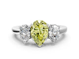 White gold Three-Stone Fancy Yellow Pear Cut Cut Diamond Ring with Channel Set Band and Four-Prong Setting_36