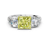 White gold Three-Stone Fancy Yellow Princess Cut Cut Diamond Ring with Channel-Set Band and Prong Setting