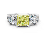 White gold Three-Stone Fancy Yellow Princess Cut Diamond Ring with Round Side Stones, Classic Band, and Four-Prong Setting_36