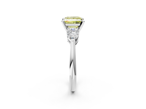 White gold Three-Stone Fancy Yellow Princess Cut Diamond Ring with Pear Side Stones and Four-Prong Setting