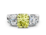 White gold Three-Stone Fancy Yellow Radiant Cut Diamond Ring with Round Side Stones, Classic Band, and Four-Prong Setting