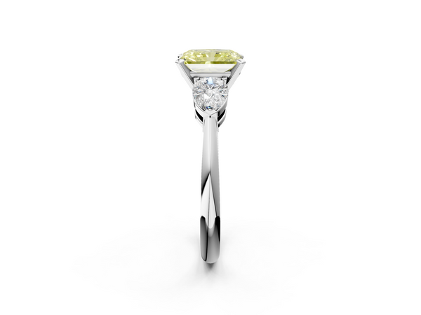 White gold Three-Stone Fancy Yellow Radiant Cut Diamond Ring with Pear Side Stones and Four-Prong Setting