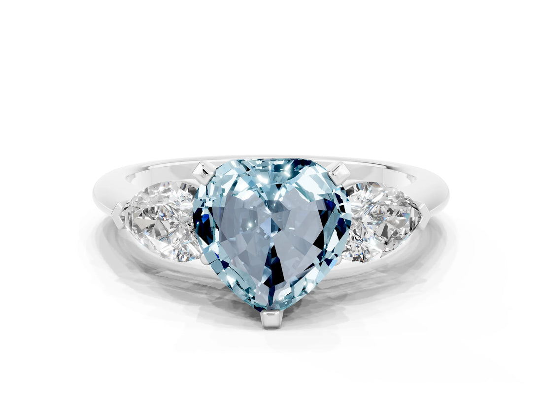 White gold Three-Stone Heart Cut Aquamarine Ring with Pear Side Stones and Four-Prong Setting