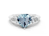 White gold Three-Stone Heart Cut Aquamarine Ring with Pear Side Stones and Four-Prong Setting