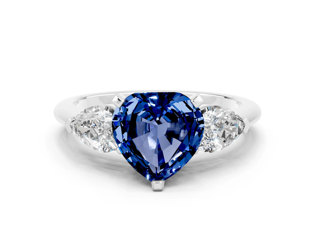 White gold Three-Stone Heart Cut Blue Sapphire Ring with Pear Side Stones and Four-Prong Setting