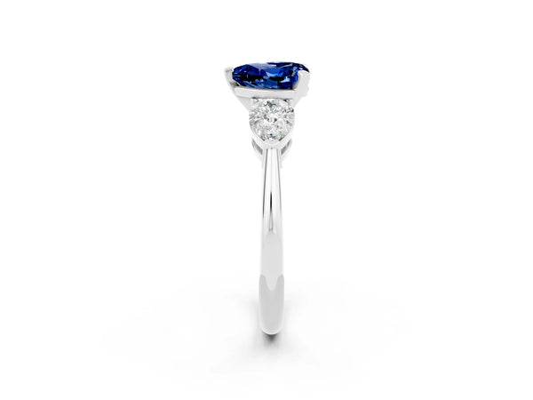 White gold Three-Stone Heart Cut Blue Sapphire Ring with Pear Side Stones and Four-Prong Setting