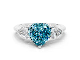 White gold Three-Stone Heart Cut Blue Topaz Ring with Pear Side Stones and Four-Prong Setting