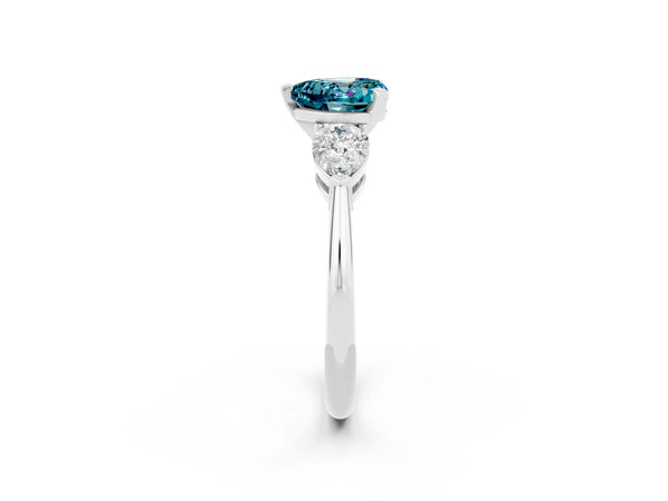 White gold Three-Stone Heart Cut Blue Topaz Ring with Pear Side Stones and Four-Prong Setting