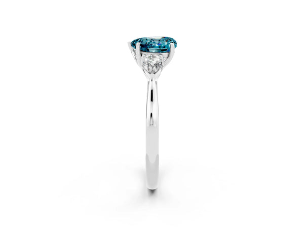 Platinum Three-Stone Heart Cut Blue Topaz Ring with Pear  Side Stones in Four-Prong Setting
