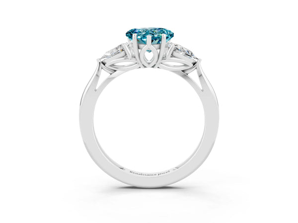Platinum Three-Stone Heart Cut Blue Topaz Ring with Pear  Side Stones in Four-Prong Setting