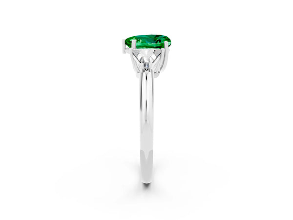 Silver Three-Stone Heart Cut Emerald Engagement Ring with Trillion Side Stones and Prong Setting