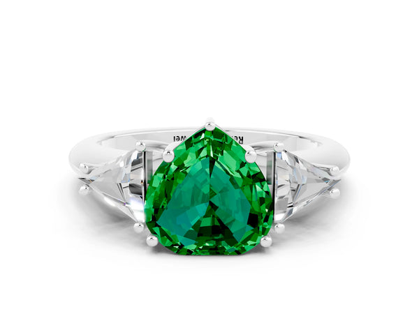 Silver Three-Stone Heart Cut Emerald Engagement Ring with Trillion Side Stones and Prong Setting