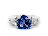 White gold Three-Stone Heart Cut Cut Diamond Ring with Trillion Side Stones and Four-Prong Setting