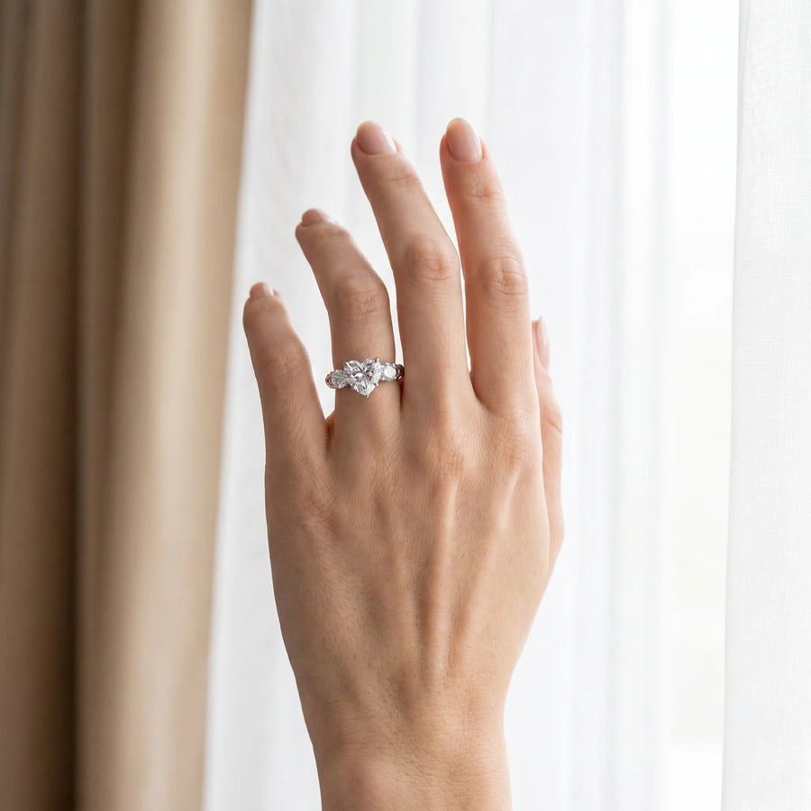 White gold Three-Stone Heart Cut Diamond Ring with Channel-Set Band and Prong Setting
