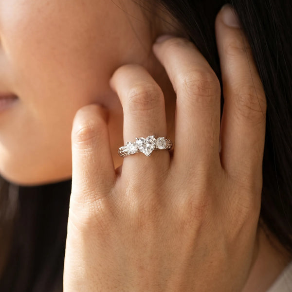 White gold Three-Stone Heart Cut Diamond Ring with Channel-Set Band and Prong Setting