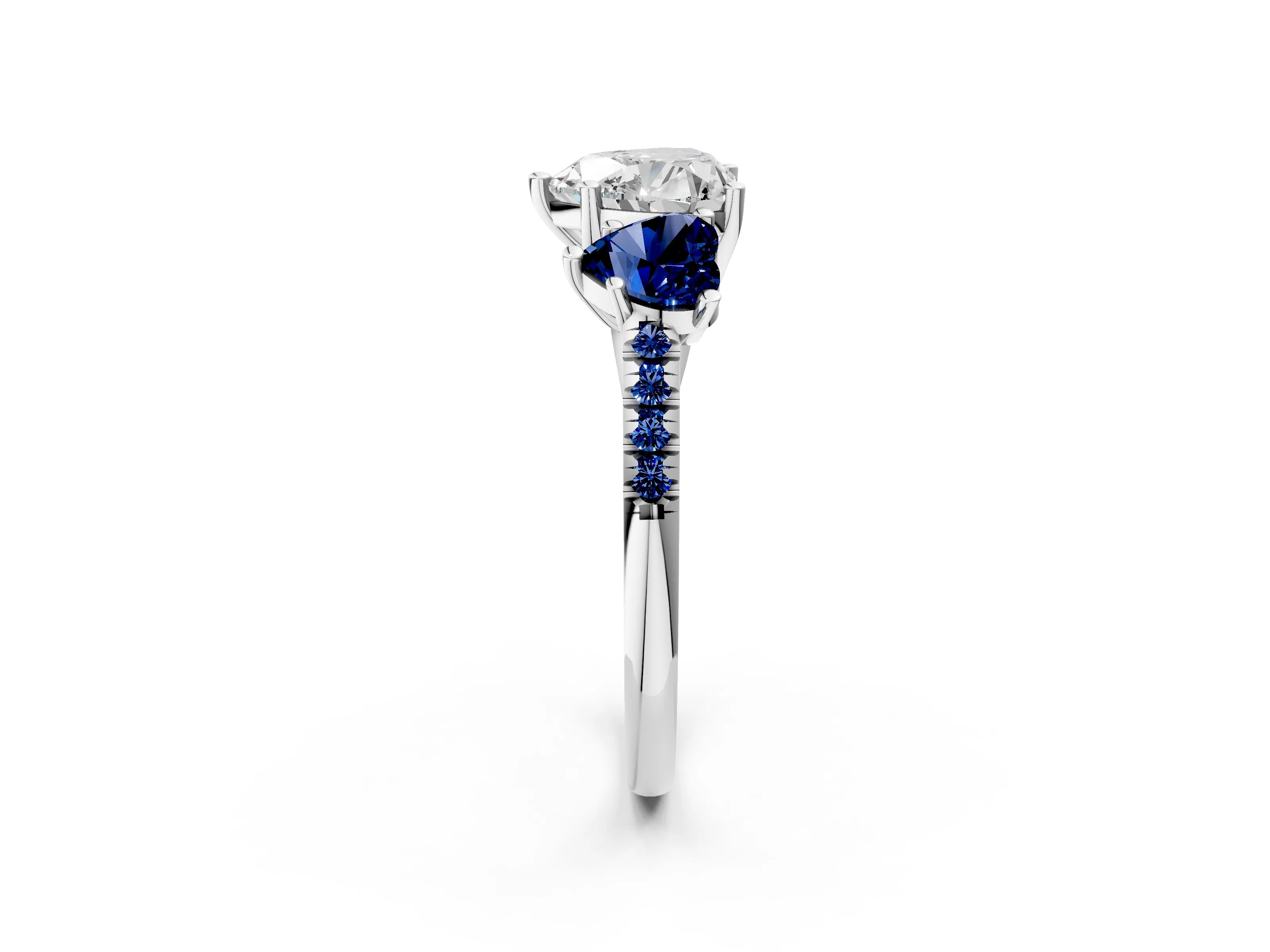 White gold Three-Stone Heart Cut Diamond Ring with Round with Blue Sapphire side stone Pavé Band and Prong Setting_2