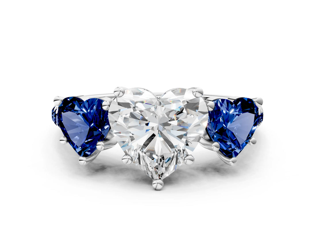 White gold Three-Stone Heart Cut Diamond Ring with Round with Blue Sapphire side stone Pavé Band and Prong Setting